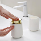 White and Gold Bathroom Accessories 2 Piece Set Luxury Matte Plastic Soap Dispenser and Toothbrush Holder for Modern Bathroom Decor
