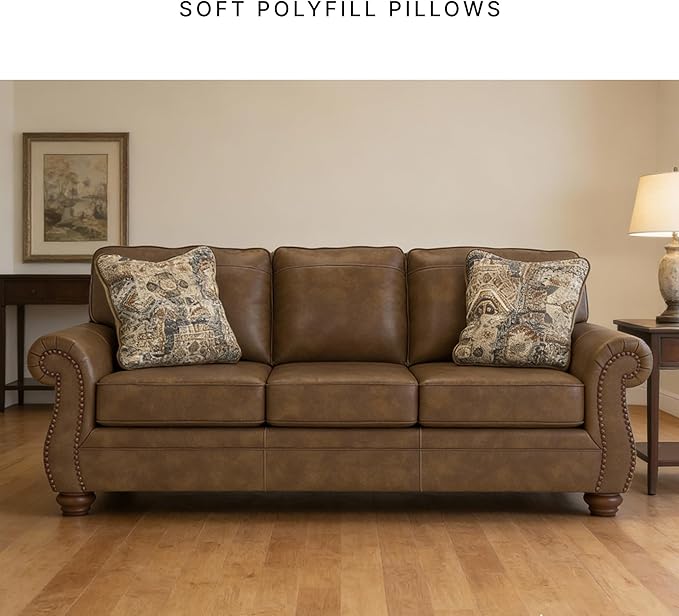 Signature Design by Ashley Shadsburne Rustic Faux Leather Sofa with Nailhead Trim and 2 Throw Pillows, Brown