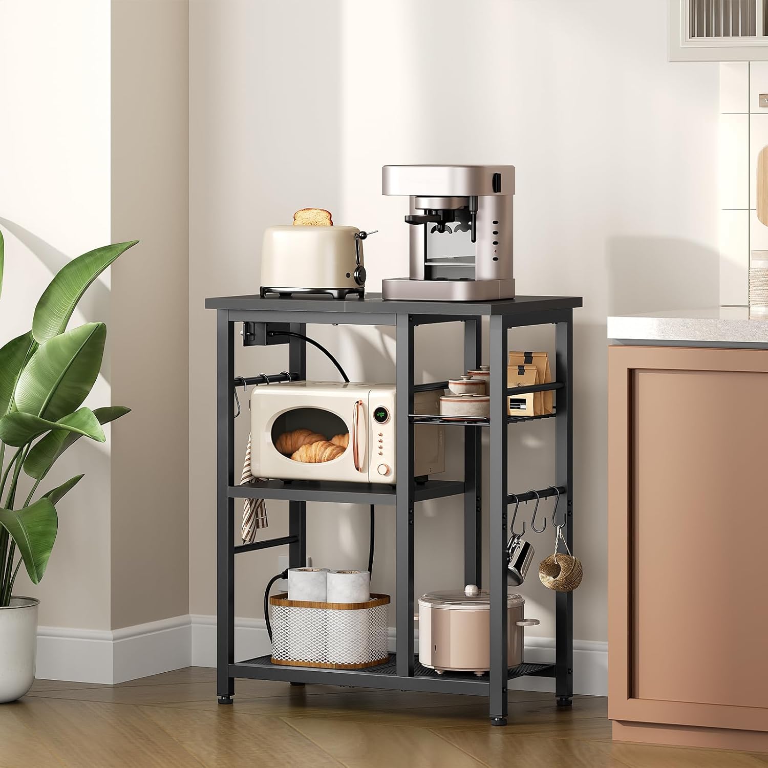 YATINEY Movable Bakers Rack, Microwave Stand with Charging Station, Kitchen Storage Rack with Hooks and Basket, Casters and Adjustable Feet, for Small Space, Kitchen, Dining Room, Black HB04UBB
