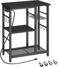 YATINEY Movable Bakers Rack, Microwave Stand with Charging Station, Kitchen Storage Rack with Hooks and Basket, Casters and Adjustable Feet, for Small Space, Kitchen, Dining Room, Black HB04UBB