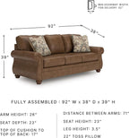 Signature Design by Ashley Shadsburne Rustic Faux Leather Sofa with Nailhead Trim and 2 Throw Pillows, Brown