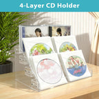 4-tier clear acrylic cascading CD holder, DVD/CD display stand, storage box, and vinyl record shelf. Holds up to 32 standard CD cases and includes 20 CD/DVD sleeves for organized media storage.