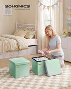 SONGMICS Folding Storage Ottoman Bench, Linen Fabric, Storage Chest, Foot Rest Stool, Holds up to 286.6 lb, 11.8 x 11.8 x 11.8 in, Bedroom Bench, Blue-Green Ombre, Minota Collection ULSF028X201