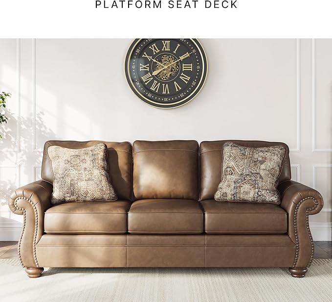 Signature Design by Ashley Shadsburne Rustic Faux Leather Sofa with Nailhead Trim and 2 Throw Pillows, Brown