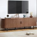 70.8" TV Stand with Power Outlet, Mid-Century Modern Television Stand, Fluted Media Console with Sliding Doors, Entertainment Center for TVs up to 60 Inch, Adjustable Shelves, Walnut