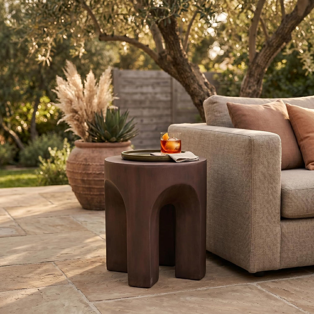 LeisureMod Round Side Table in Fiberstone with Arched Base Design Compact Wea...