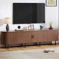 86.6" TV Stand with Power Outlet, Mid-Century Modern Television Stand, Fluted Media Console with Sliding Doors, Entertainment Center for TVs up to 90 Inch, Adjustable Shelves, Walnut