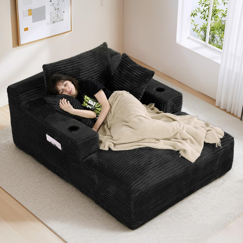 50" x 68" Corduroy Chaise Lounge, Cup Holders, Black | Oversized corduroy chaise with a deep sleeper seat, built-in cup holders, and 3 pillows for reading, lounging.