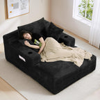 50" x 68" Corduroy Chaise Lounge, Cup Holders, Black | Oversized corduroy chaise with a deep sleeper seat, built-in cup holders, and 3 pillows for reading, lounging.