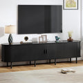 86.6" TV Stand with Power Outlet, Mid-Century Modern Television Stand, Fluted Media Console with Sliding Doors, Entertainment Center for TVs up to 90 Inch, Adjustable Shelves, Black