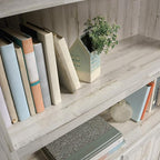 Sauder Select Book Shelf, Bookshelf with Storage, Library Bookcase with Doors and Adjustable Shelves, in White Plank